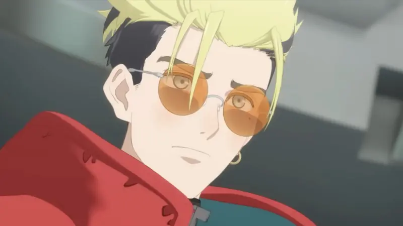 Trigun Stampede features Vash the Stampede wearing his iconic orange sunglasses and red coat.