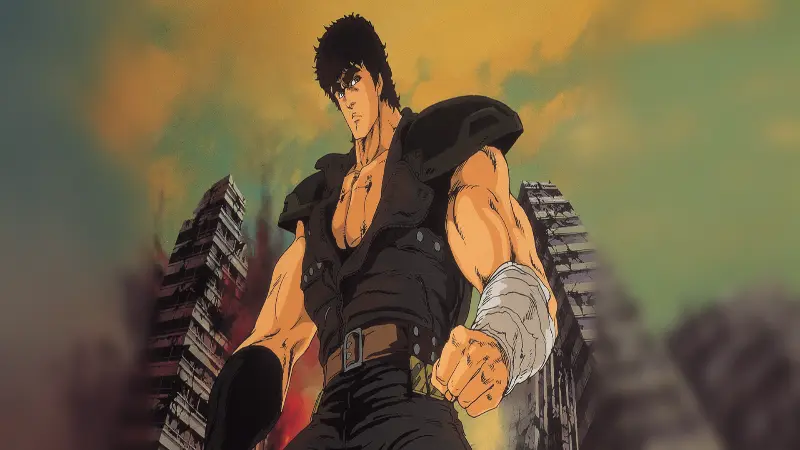 Kenshiro stands tall with wrapped fists in front of post-apocalyptic ruined buildings in Fist of the North Star.