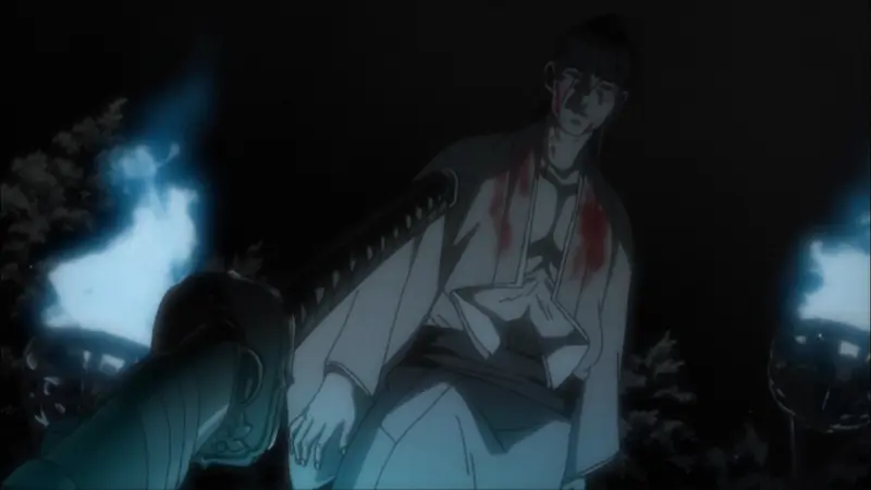 A swordsman with blood stained on his white kimono stands in the darkness during a tense, atmospheric duel in Shigurui: Death Frenzy.