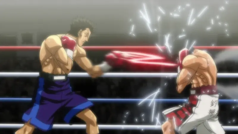 Ryuei Sawamura delivers a lightning-fast left jab to his opponent's faceguard in a dramatic boxing exchange inside the ring.