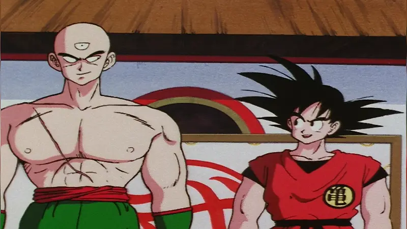Goku and Tien Shinhan standing in the martial arts ring during the 23rd Tenkaichi Budokai.