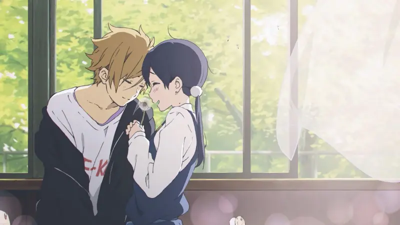 Mochizo and Tamako holding a dandelion together in front of a sunlit window in Tamako Love Story, a romance anime where the childhood friend wins.