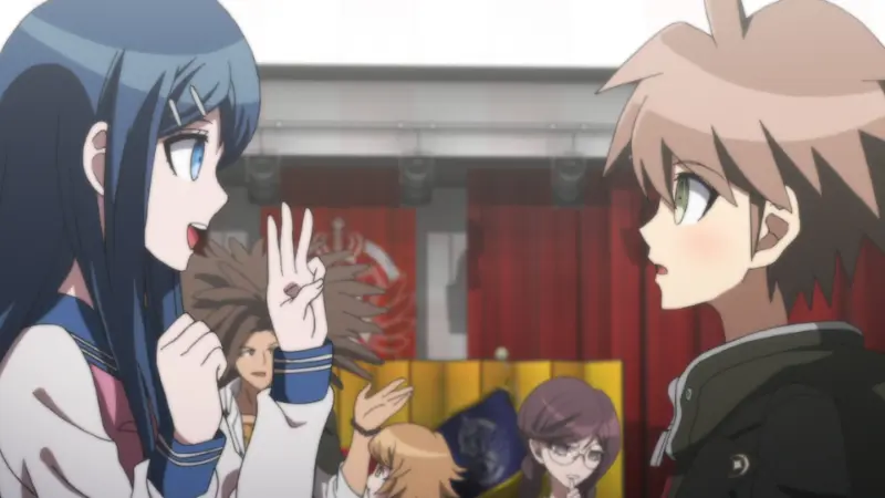 Sayaka Maizono holding up three fingers while talking to Makoto Naegi in the gym during Danganronpa: The Animation.