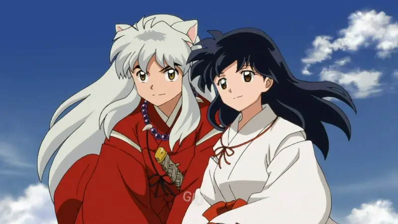 Inuyasha and Kagome Higurashi sit peacefully together outdoors against a bright blue sky with white clouds.