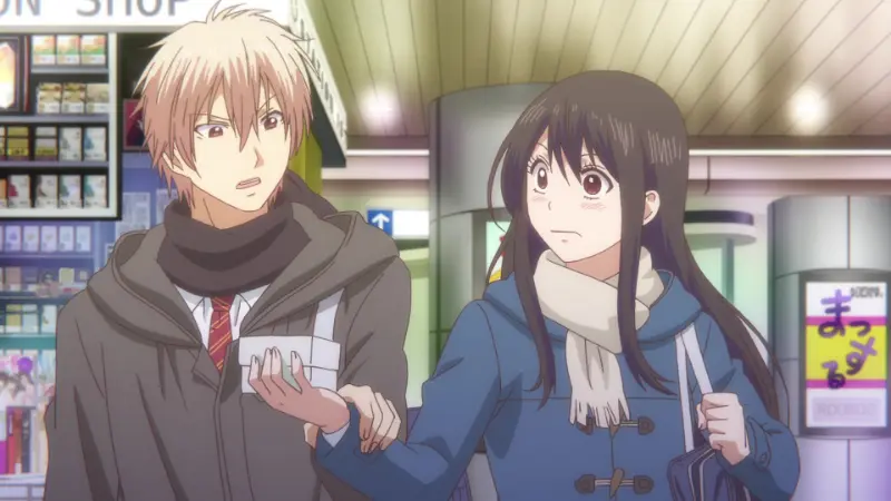 Chika Kudo and Satowa Hozuki walking side-by-side in warm winter clothing outside a lit storefront.