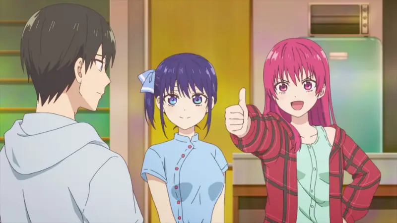 Saki Saki gives an energetic thumbs-up next to Nagisa Minase while Naoya Mukai watches them.