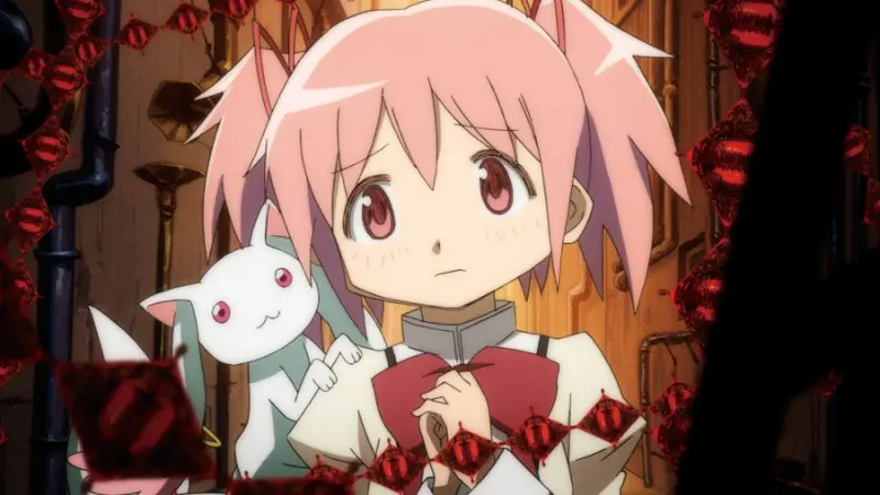 Madoka Kaname holds her hands anxiously next to Kyubey within a dark, red-chained witch labyrinth in the subversive plot twist anime Puella Magi Madoka Magica.