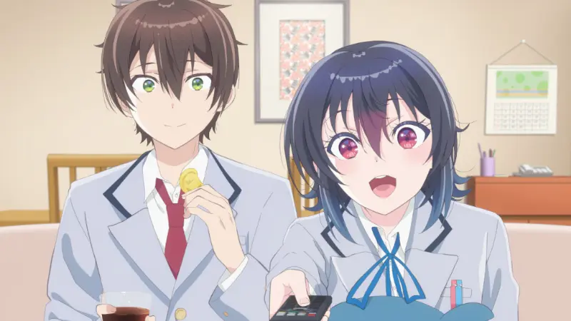Umi Asanagi excitedly holding a TV remote while sitting next to Maki Maehara eating a snack in I Made Friends with the Second Prettiest Girl in My Class.