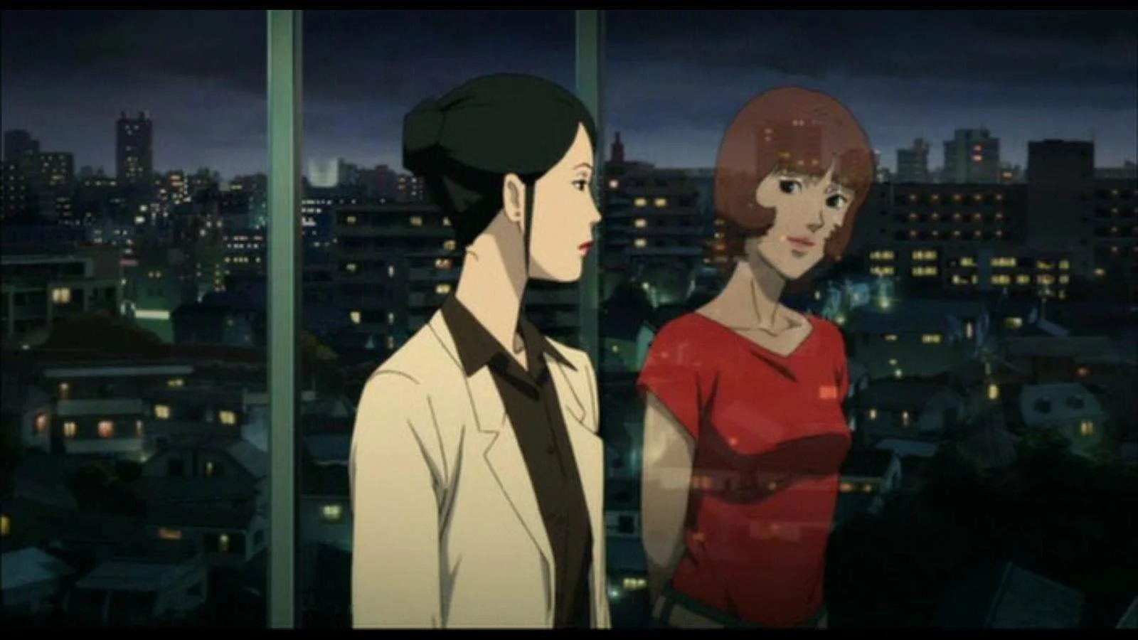 Dr. Atsuko Chiba and her dream alter-ego Paprika standing by a glass window overlooking the city at night in Paprika