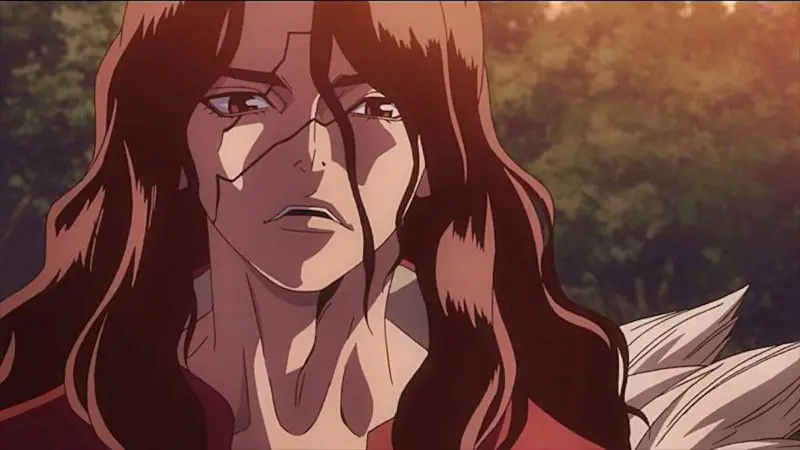 Tsukasa Shishio looks forward with a serious expression, bearing prominent stone petrification scars across his face in a lush forest in Dr. Stone.