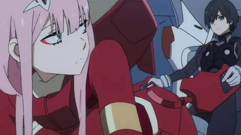 Zero Two in her red pilot suit looking back at Hiro inside the Franxx cockpit.