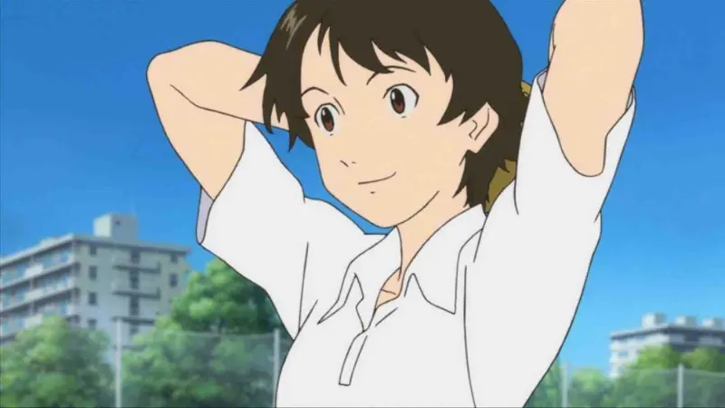 Makoto Konno happily stretches her arms back in her school uniform outdoors in the classic time travel anime film The Girl Who Leapt Through Time.