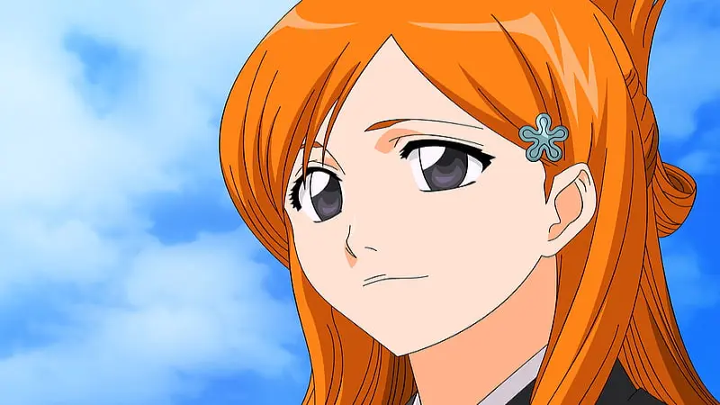 Bleach character Orihime Inoue looking forward calmly against a bright blue sky.