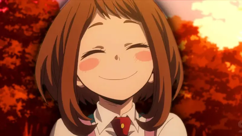 My Hero Academia hero Ochaco Uraraka delivering a beaming smile against an autumn background, rounding out our list of the best deredere characters.