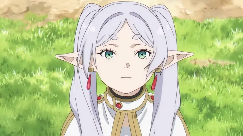 Frieren: Beyond Journey's End protagonist Frieren standing outdoors in a green field, a prime example of the best kuudere anime characters.