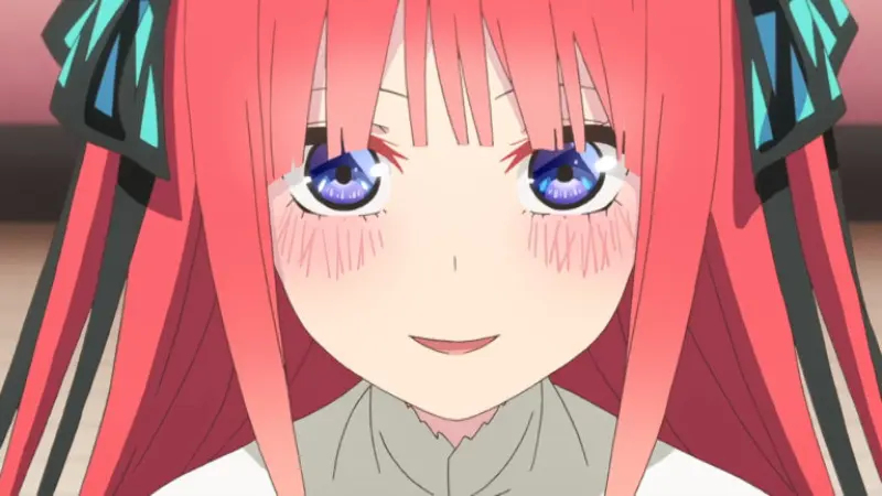 The Quintessential Quintuplets features Nino Nakano blushing softly while wearing her signature butterfly hair ribbons.
