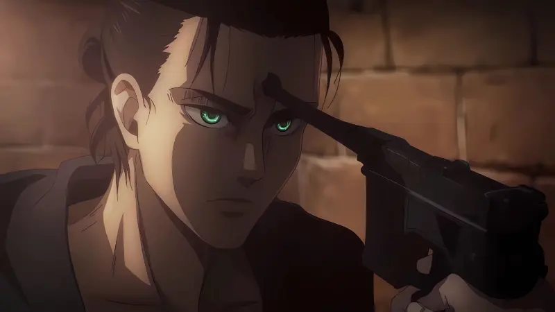 An older Eren Yeager stares intensely with glowing green eyes while holding the barrel of a pistol to his own forehead in Attack on Titan.