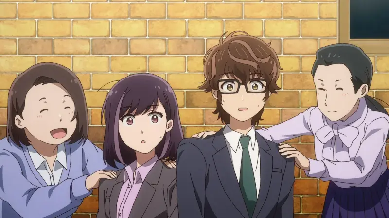Takuya and Rika look startled in their office suits while two smiling female coworkers lean in to talk to them against a brick wall.