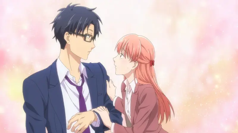 Hirotaka and Narumi gaze affectionately into each other's eyes while dressed in professional office attire against a soft pink backdrop.
